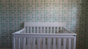 when to lower crib height