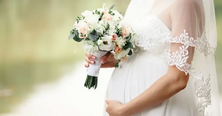 how to hide a baby bump in a wedding dress