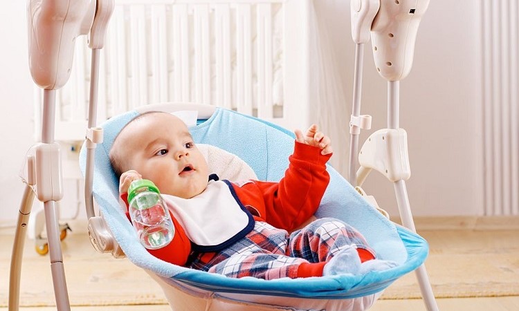 Can I Put Swaddled Baby in Swing